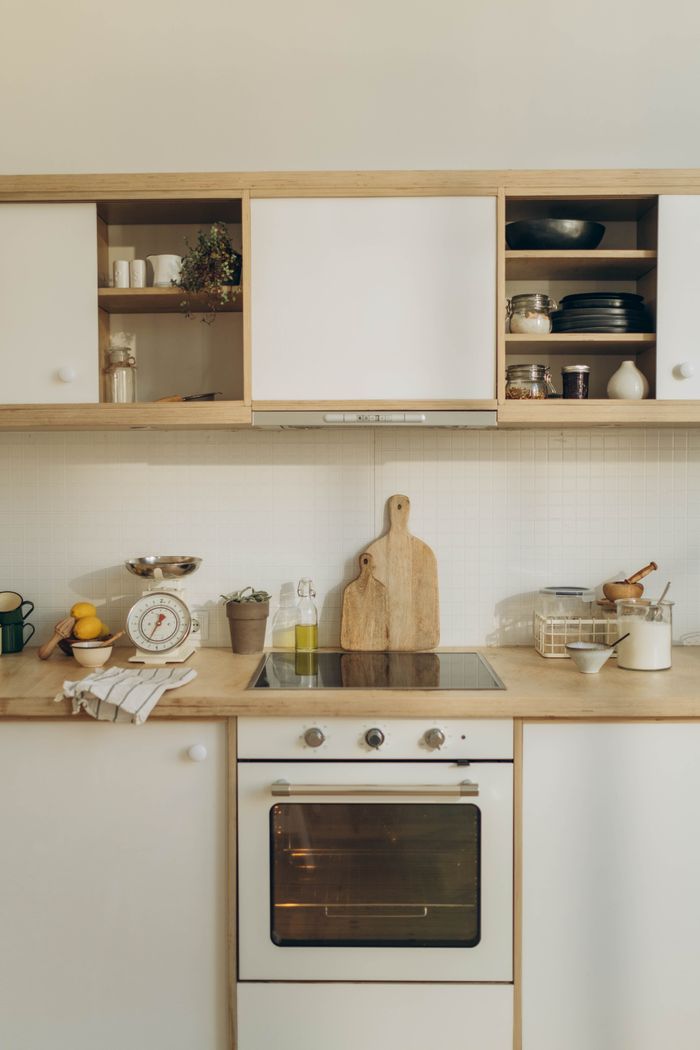 A well-organized modern kitchen featuring wooden cabinets and countertop, ideal for interior design inspiration.
